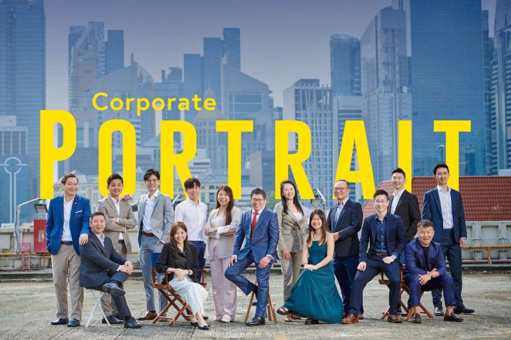 corporate group photoshoot with Singapore skyline. Singapore Outdoor corporate group portrait photography location shoot with singapore skyline