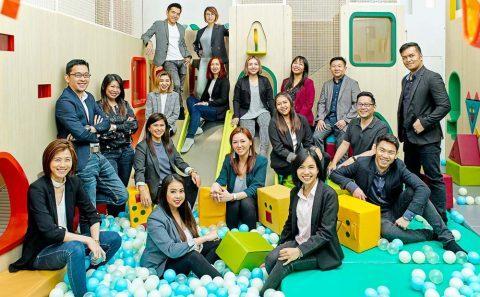 candid corporate group portraiture in a indoor playground.