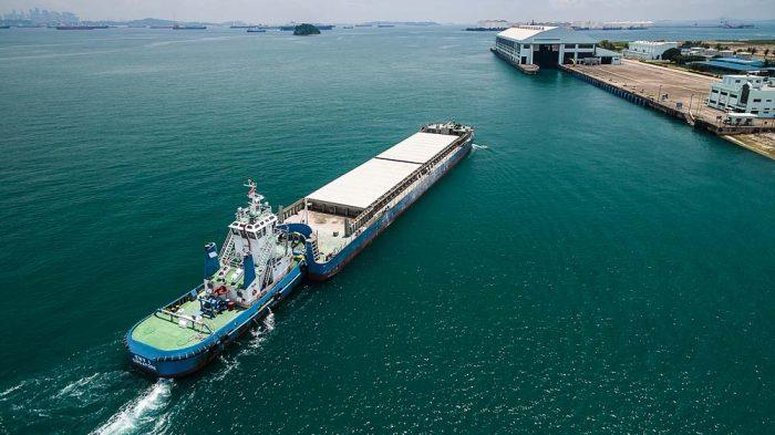 Industrial photography project with drone image of barge and semakau island