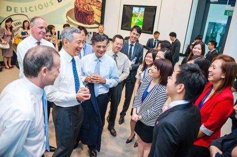 a candid moment captured by our corporate events photographer showing prime minister lee hsien loong talking to the employees of he newly opened Unilever Four Acre campus.