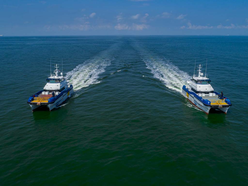 professional photo of drone image for two catamaran doing sea trial