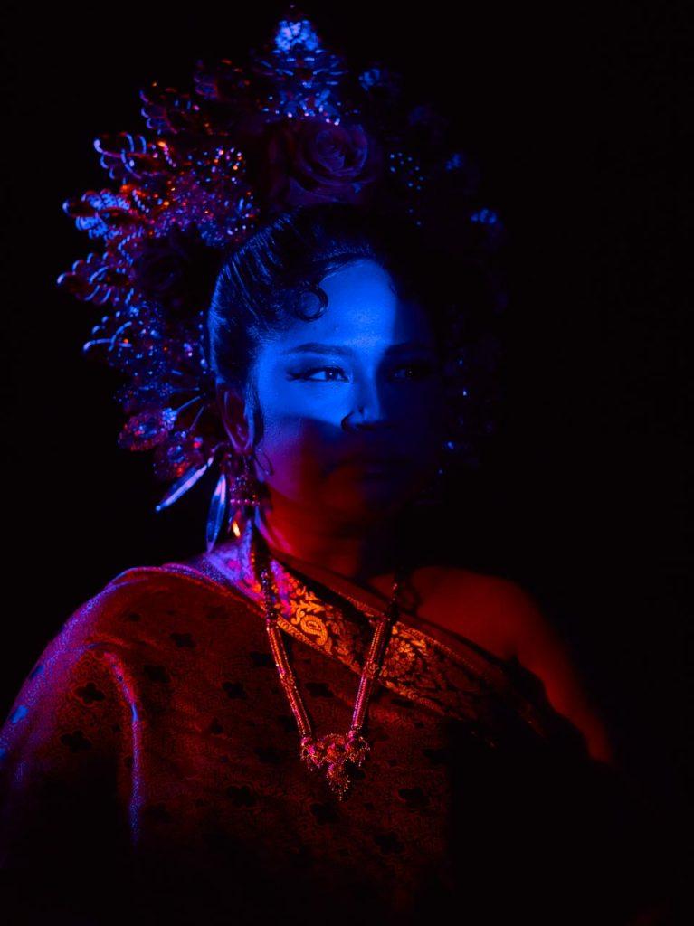 Low key creative portraiture. mood shot with dark shadows and colour lightings