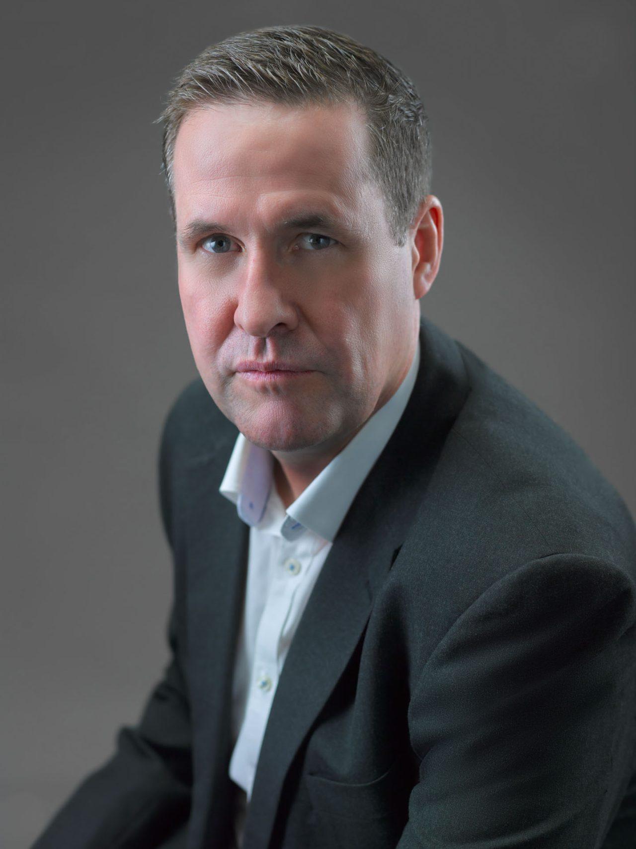 Corporate Studio portrait, professional business headshot with a grey background — singapore corporate portrait photography, corporate portrait photographer singapore
