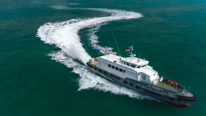 MV Heers 1 turning under water-jet propulsion, seen from the air, aerial photography and videography