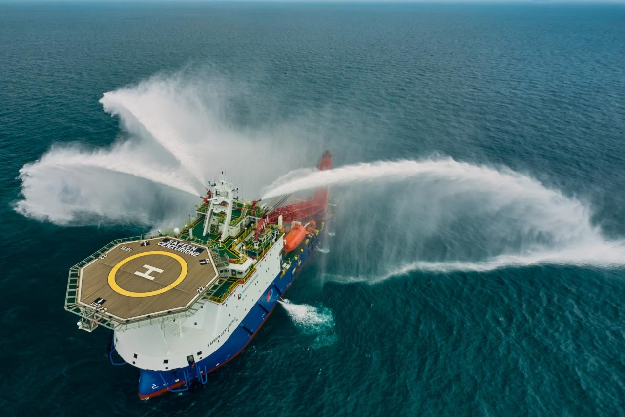 industrial photography of multi utility vessel with heli pad in the sea