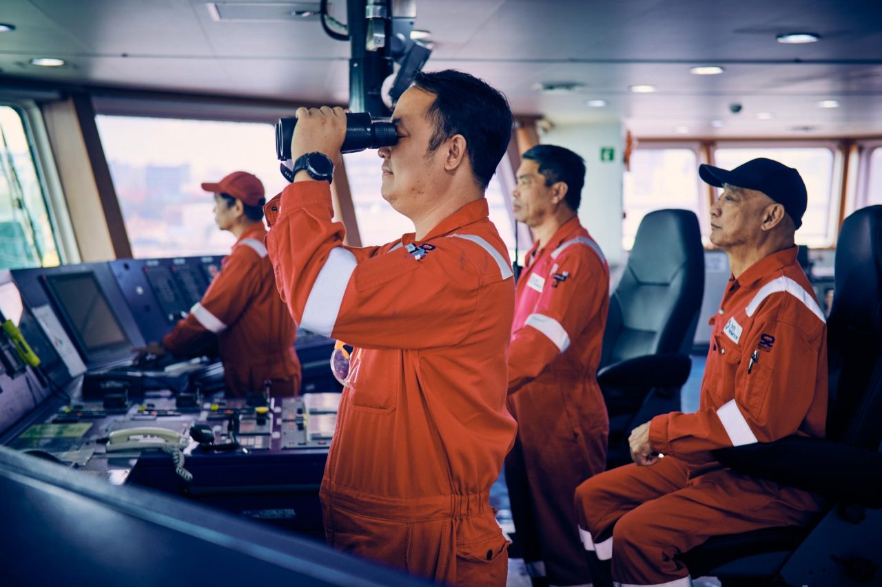 industrial photography crew working on a multi utility vessel with helipad in the sea