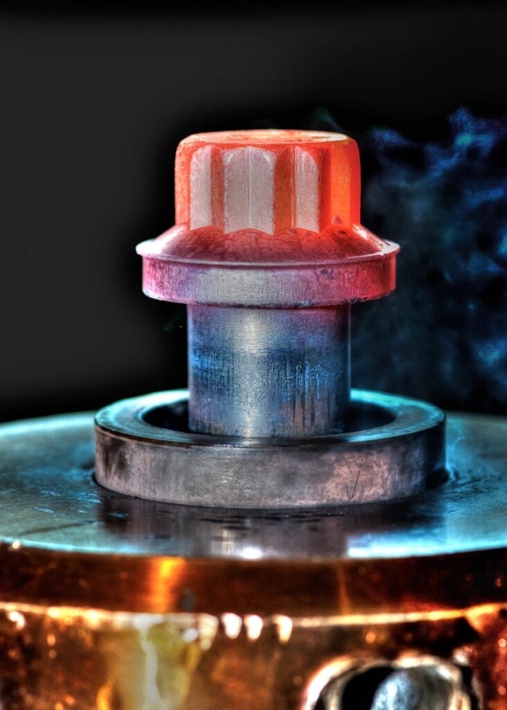 A machined component and fastener photographed in detail for precision engineering documentation. Product photo shoot for steel manufacturing, professional photographer, Corporate photographer for portraits and headshots