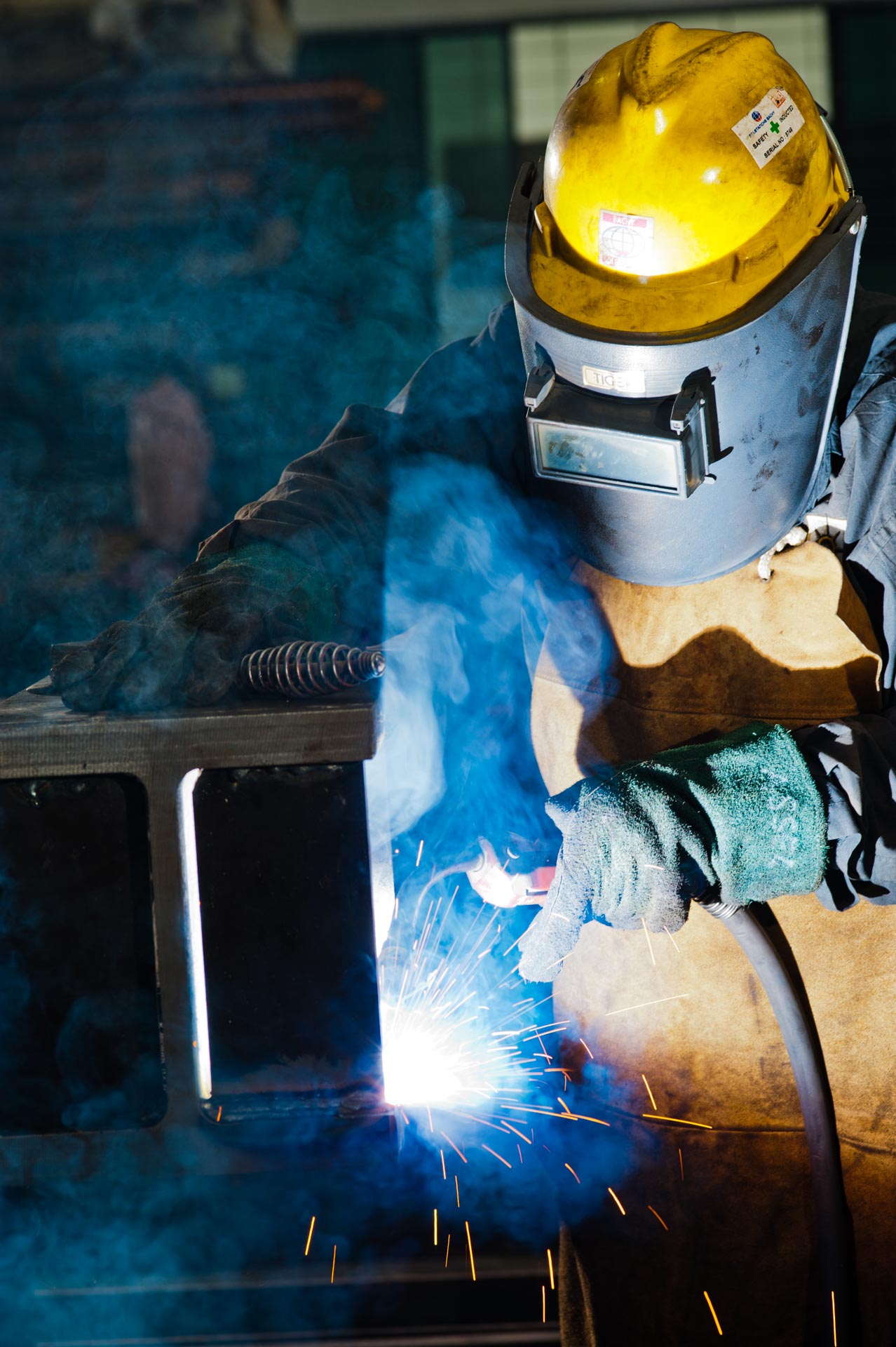 corporate lifestyle photography of man welding.Singapore Industrial photography | professional corporate photographer