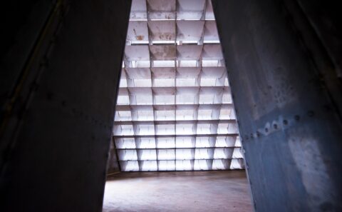 Looking through the acoustic splitter panels of the Rolls-Royce Seletar engine test cell towards the backlit intake wall