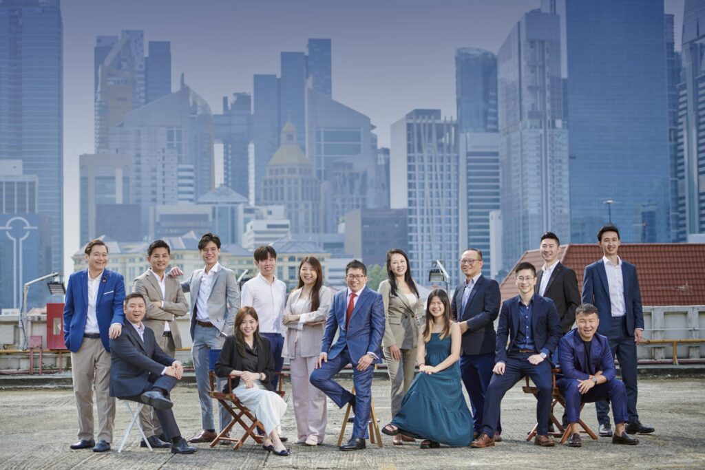 Creative environmental corporate Team portrait photography with beautiful cityscape as backdrop.